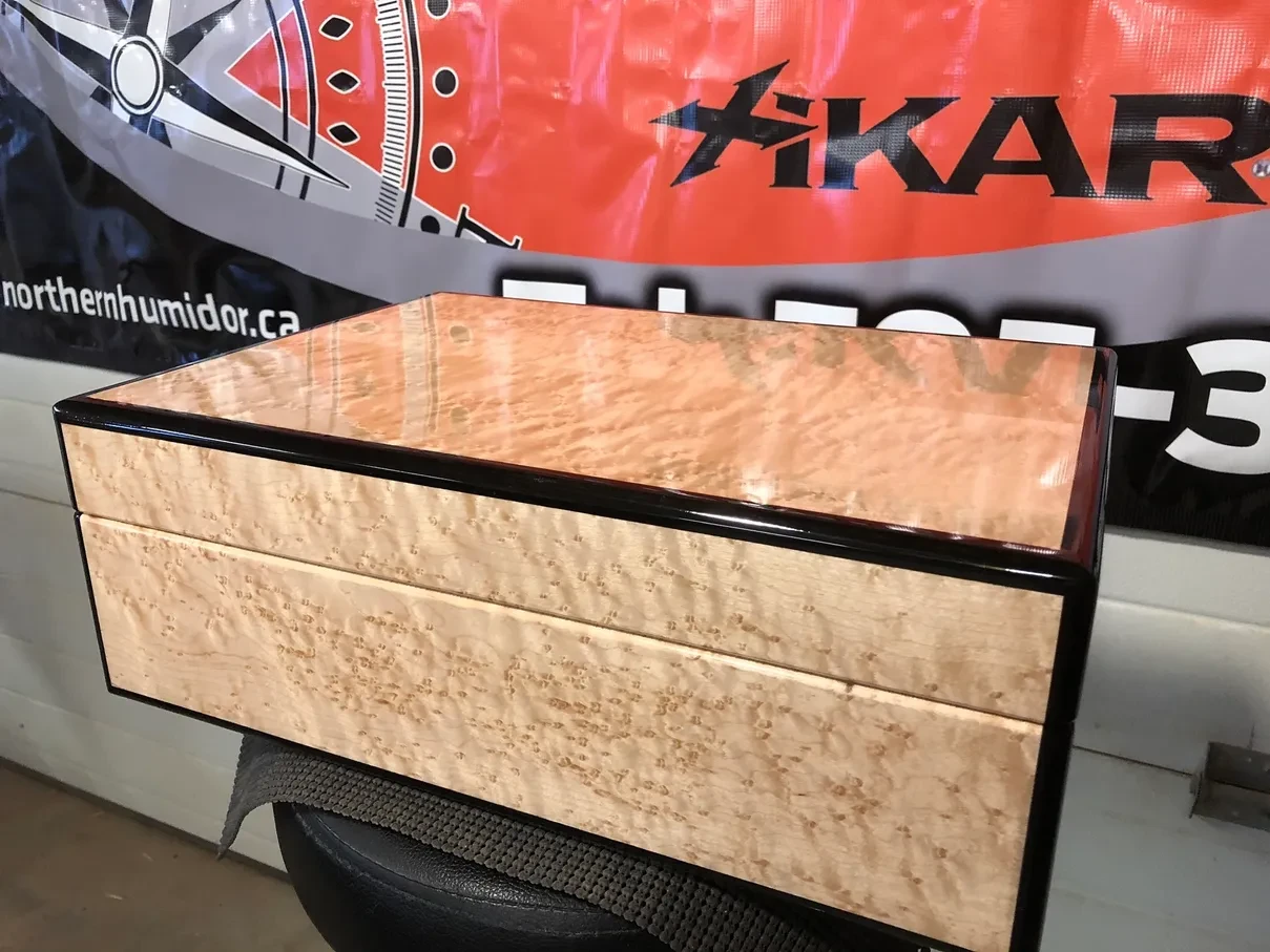 Interior of a birds eye maple and ebony humidor